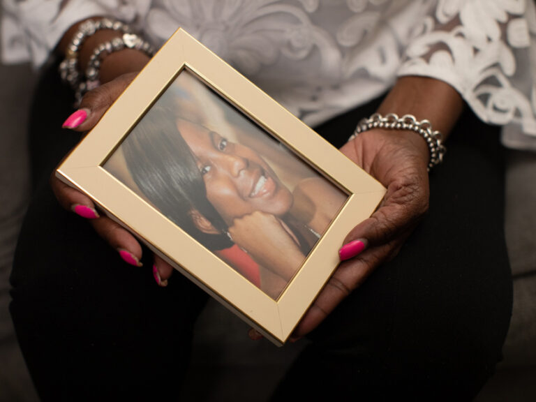 Tammy Pittman holds a portrait of her daughter, Shante Bonahan.