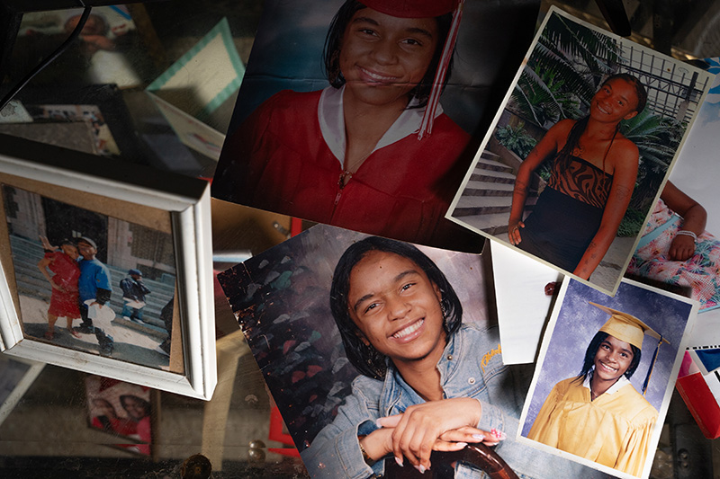 Collage of photographs of Shantieya Smith displayed in her mother’s living room.